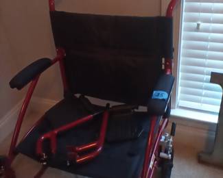 Red transport wheel chair.