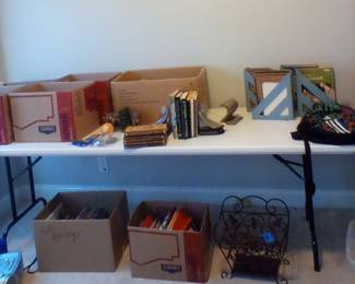 Books of all types.  Some old some new. Wrought iron magazine rack, radio and CD player. 