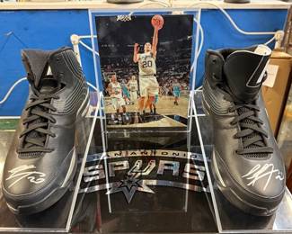 Manu Ginobili signed shoes, encased.