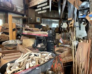Antlers pieces, bug and small. radial saw. sewing machine and thread and pieces, saws, wood clampings, bamboo pieces big and small