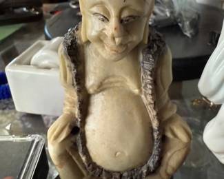 Carved happy Budha. HiBid link: https://modestlambestatesales.hibid.com/