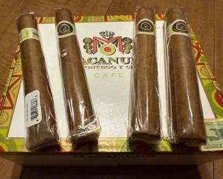Macanudo cigars w/ box. HiBid link: https://modestlambestatesales.hibid.com/