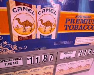 Camel cigarette store display. HiBid link: https://modestlambestatesales.hibid.com/