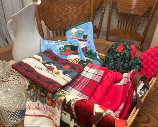 So many Christmas towels and pot holders! Baskets, pitcher