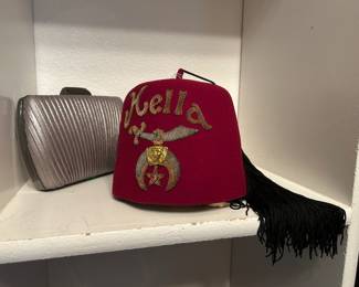 Fez with brooch, clutch