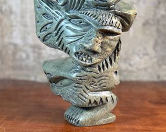 This lot features a stunning Inuit spirit carving in green soapstone by listed Inuit artist, Tytosie Tunnillie. Signed underneath as shown in photos and measures, 13” H x 8.5” W x 4.5” D.
