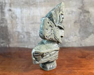 This lot features a stunning Inuit spirit carving in green soapstone by listed Inuit artist, Tytosie Tunnillie. Signed underneath as shown in photos and measures, 13” H x 8.5” W x 4.5” D.
