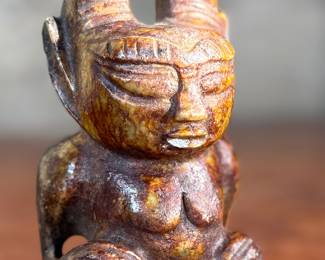 This lot features what appears to be a carved figure, commonly identified as a Hongshan culture jade sculpture. This item measures, 4.5” H x 2.5” W x 2” D.
