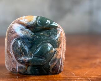 This lot features a hand-carved Inuit stone sculpture that measures, 4” H x 4” W x 2” D.
