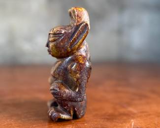 This lot features what appears to be a carved figure, commonly identified as a Hongshan culture jade sculpture. This item measures, 4.5” H x 2.5” W x 2” D.
