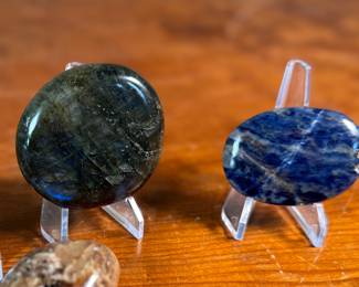 This lot features a collection of palm stones in excellent condition. The sodalite weighs 2.3oz and measures 3”, the labradorite weighs 5oz and measures 3”, and the pair of black opalite palm stones weigh 2.2oz each and measure, 2.5”.
