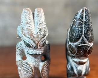 This lot features a pair of Chinese Hongshan Culture hand-carved amulet sculptures, sometimes described as "Sun God Helios" statutes. Each one measures, 5.5” H.
