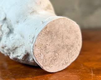 This lot features a head of a statue of Alexander the Great. Appears to be made of a heavy plaster and measures, 10.5” H x 8” W x 9” D.
