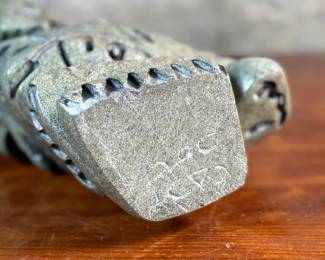 This lot features a stunning Inuit spirit carving in green soapstone by listed Inuit artist, Tytosie Tunnillie. Signed underneath as shown in photos and measures, 13” H x 8.5” W x 4.5” D.
