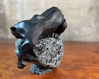 This lot features a black panther sculpture designed by Alexsander Danel for Austin Sculptures, likely produced in the 1990s. Made from a molded resin material, this sculpture measures, 7” H x 8” W x 4” D.
