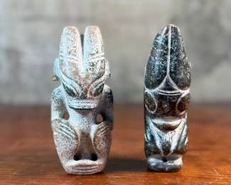 This lot features a pair of Chinese Hongshan Culture hand-carved amulet sculptures, sometimes described as "Sun God Helios" statutes. Each one measures, 5.5” H.
