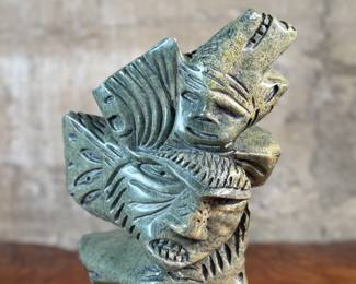This lot features a stunning Inuit spirit carving in green soapstone by listed Inuit artist, Tytosie Tunnillie. Signed underneath as shown in photos and measures, 13” H x 8.5” W x 4.5” D.
