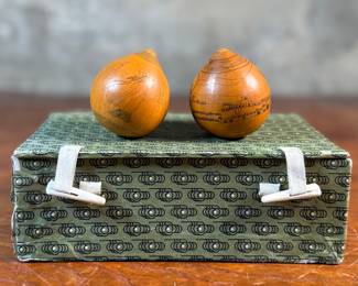 This lot features a pair of Chinese Lanzhou etched gourds displayed in a box. This type of gourd carving is a traditional folk art unique to Lanzhou, China, where carvers use fine tools to engrave landscapes, figures, and calligraphy onto the surface of the gourds. 
