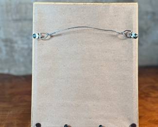 This lot features an original Cubist inspired oil on board, unsigned by artist and measures in frame, 10.75” H x 8.75” W.
