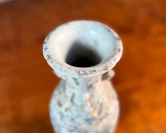 This lot features an antique Chinese sandy glazed vase that measures, 10” H x 4” W x 4” D.
