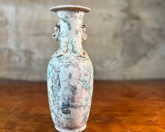 This lot features an antique Chinese sandy glazed vase that measures, 10” H x 4” W x 4” D.
