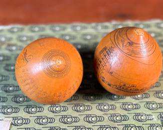 This lot features a pair of Chinese Lanzhou etched gourds displayed in a box. This type of gourd carving is a traditional folk art unique to Lanzhou, China, where carvers use fine tools to engrave landscapes, figures, and calligraphy onto the surface of the gourds. 
