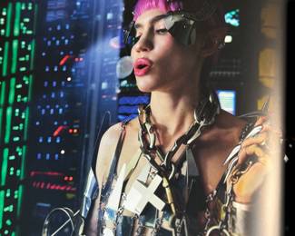 This lot features a 2022 “calendar” by Bryan Adams for Pirelli titled, “On the Road”. A unique book full of famous photographs. A collectible edition in the original slipcase. Bryan Adams is known for photographing the 2022 Pirelli Calendar, which is titled “On the Road” and features portraits of various musicians like Cher, Iggy Pop, Jennifer Hudson, and Rita Ora. Adams, a successful photographer as well as a musician, created the calendar to capture the glamour and loneliness of a musician’s life on tour.
