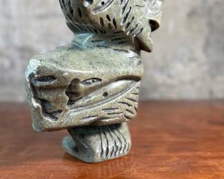 This lot features a stunning Inuit spirit carving in green soapstone by listed Inuit artist, Tytosie Tunnillie. Signed underneath as shown in photos and measures, 13” H x 8.5” W x 4.5” D.
