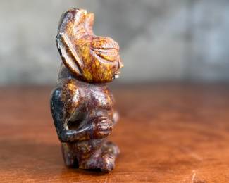 This lot features what appears to be a carved figure, commonly identified as a Hongshan culture jade sculpture. This item measures, 4.5” H x 2.5” W x 2” D.
