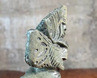 This lot features a stunning Inuit spirit carving in green soapstone by listed Inuit artist, Tytosie Tunnillie. Signed underneath as shown in photos and measures, 13” H x 8.5” W x 4.5” D.
