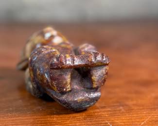 This lot features what appears to be a carved figure, commonly identified as a Hongshan culture jade sculpture. This item measures, 4.5” H x 2.5” W x 2” D.
