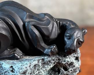 This lot features a black panther sculpture designed by Alexsander Danel for Austin Sculptures, likely produced in the 1990s. Made from a molded resin material, this sculpture measures, 7” H x 8” W x 4” D.
