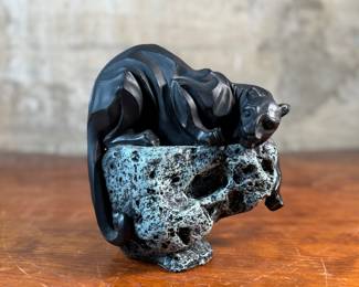 This lot features a black panther sculpture designed by Alexsander Danel for Austin Sculptures, likely produced in the 1990s. Made from a molded resin material, this sculpture measures, 7” H x 8” W x 4” D.
