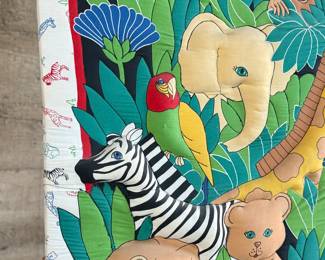 This lot features a safari animal quilt fabric that has been mounted and is ready to hang and display! This piece measures, 34” H x 26” W.
