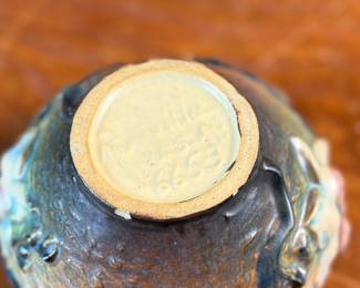 This lot features a collection of seven (7) Roseville Pottery items in the "Magnolia" pattern, which was introduced in 1943. The set includes a large cider pitcher and several matching mugs, featuring pink and white blossoms on a textured russet and green ground. All items are in excellent condition with one piece showing a very small chip as shown in photos. The pitcher measures, 8.5” H.
