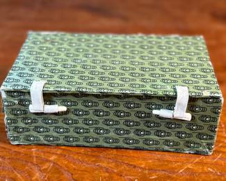 This lot features a pair of Chinese Lanzhou etched gourds displayed in a box. This type of gourd carving is a traditional folk art unique to Lanzhou, China, where carvers use fine tools to engrave landscapes, figures, and calligraphy onto the surface of the gourds. 
