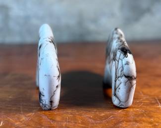 This lot features a pair of beautiful Native American Navajo horse hair pottery buffalo sculptures. Both are signed by artists as shown in photos and each measures, 4” H x 6.5” W x 1.25” D.
