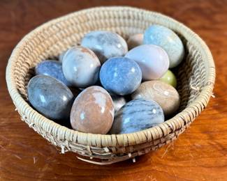 This lot features a collection of fifteen (15) polished stone eggs made from various materials in excellent condition and a fun basket to carry them to your car in!
