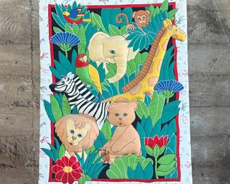 This lot features a safari animal quilt fabric that has been mounted and is ready to hang and display! This piece measures, 34” H x 26” W.
