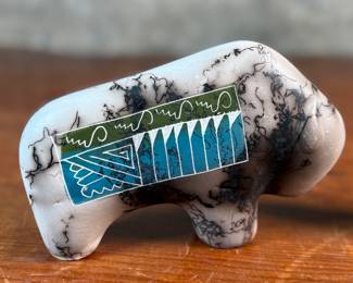 This lot features a pair of beautiful Native American Navajo horse hair pottery buffalo sculptures. Both are signed by artists as shown in photos and each measures, 4” H x 6.5” W x 1.25” D.
