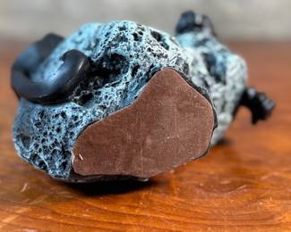 This lot features a black panther sculpture designed by Alexsander Danel for Austin Sculptures, likely produced in the 1990s. Made from a molded resin material, this sculpture measures, 7” H x 8” W x 4” D.
