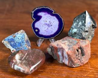 This lot features a collection of stunning rocks & minerals. The raw emerald tower weighs 15.5oz and measures, 3.5” H. The raw azurite rough freeform is from Phoenix and weighs 6.7oz and measures, 3.5” H x 2.5” W. The petrified wood heart weighs 7.6oz and measures, 3” W.
