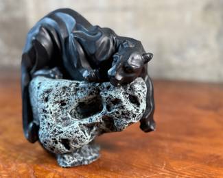 This lot features a black panther sculpture designed by Alexsander Danel for Austin Sculptures, likely produced in the 1990s. Made from a molded resin material, this sculpture measures, 7” H x 8” W x 4” D.
