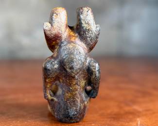 This lot features what appears to be a carved figure, commonly identified as a Hongshan culture jade sculpture. This item measures, 4.5” H x 2.5” W x 2” D.
