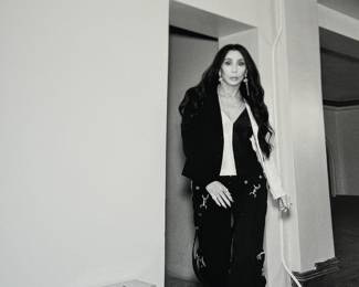 This lot features a 2022 “calendar” by Bryan Adams for Pirelli titled, “On the Road”. A unique book full of famous photographs. A collectible edition in the original slipcase. Bryan Adams is known for photographing the 2022 Pirelli Calendar, which is titled “On the Road” and features portraits of various musicians like Cher, Iggy Pop, Jennifer Hudson, and Rita Ora. Adams, a successful photographer as well as a musician, created the calendar to capture the glamour and loneliness of a musician’s life on tour.
