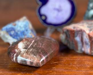 This lot features a collection of stunning rocks & minerals. The raw emerald tower weighs 15.5oz and measures, 3.5” H. The raw azurite rough freeform is from Phoenix and weighs 6.7oz and measures, 3.5” H x 2.5” W. The petrified wood heart weighs 7.6oz and measures, 3” W.
