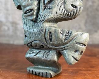 This lot features a stunning Inuit spirit carving in green soapstone by listed Inuit artist, Tytosie Tunnillie. Signed underneath as shown in photos and measures, 13” H x 8.5” W x 4.5” D.

