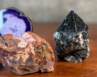 This lot features a collection of stunning rocks & minerals. The raw emerald tower weighs 15.5oz and measures, 3.5” H. The raw azurite rough freeform is from Phoenix and weighs 6.7oz and measures, 3.5” H x 2.5” W. The petrified wood heart weighs 7.6oz and measures, 3” W.
