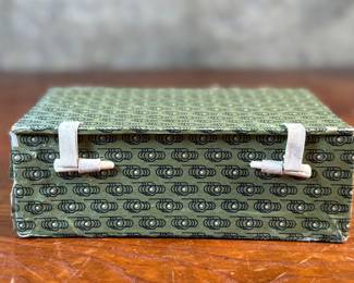 This lot features a pair of Chinese Lanzhou etched gourds displayed in a box. This type of gourd carving is a traditional folk art unique to Lanzhou, China, where carvers use fine tools to engrave landscapes, figures, and calligraphy onto the surface of the gourds. 
