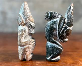 This lot features a pair of Chinese Hongshan Culture hand-carved amulet sculptures, sometimes described as "Sun God Helios" statutes. Each one measures, 5.5” H.
